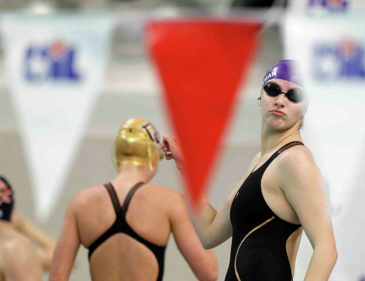 Kaitlyn Weightman of Montgomery turns back to teammates as she dances before the Class 5A girls 200-yard freestyle during the UIL State Swimming and Diving Championships at Lee & Joe Jamail Texas Swimming Center, Saturday, Feb. 19, 2022, in Austin.