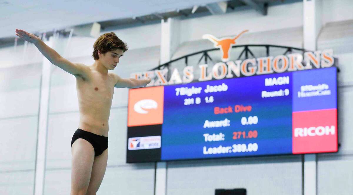 Jake Bigler of Magnolia competes in the Class 5A boys 1-meter diving during the UIL State Swimming and Diving Championships at Lee & Joe Jamail Texas Swimming Center, Saturday, Feb. 19, 2022, in Austin.
