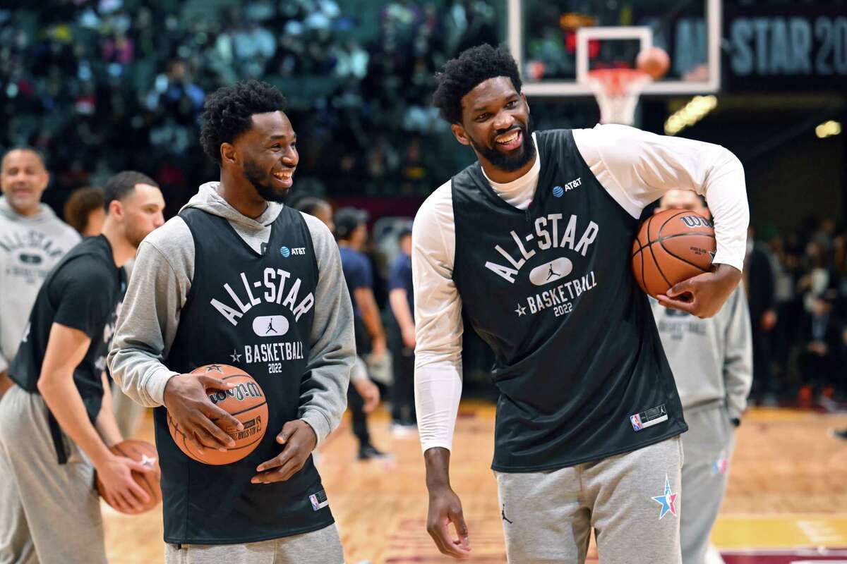CLEVELAND, OHIO - FEBRUARY 19: Andrew Wiggins #22 and Joel Embiid #21 of Team Durant talk during the NBA All-Star practice at the Wolstein Center on February 19, 2022 in Cleveland, Ohio. 
