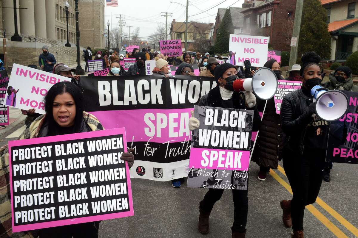 Participants in the Black Women Speak march depart City Hall on their way to a rally in front of the Morton Government Center, in Bridgeport, Conn. Feb. 19, 2022.