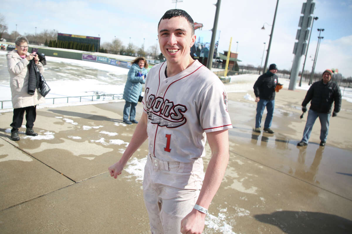 Great Lakes Loons announcer Brad Tunney reacts after jumping into the cold water for the 2022 Great Lakes Bay Polar Plunge at Dow Diamond on Saturday, February 19, 2022.