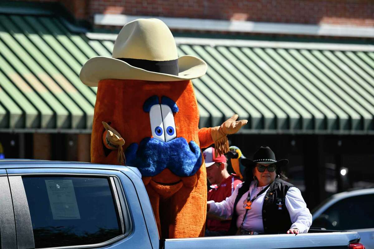 The Houston Livestock Show and Rodeo mascot, Howdy waves to the crowd at the 57th Annual Go Texan Parade Saturday, Feb. 19, 2022, in Conroe, Texas.