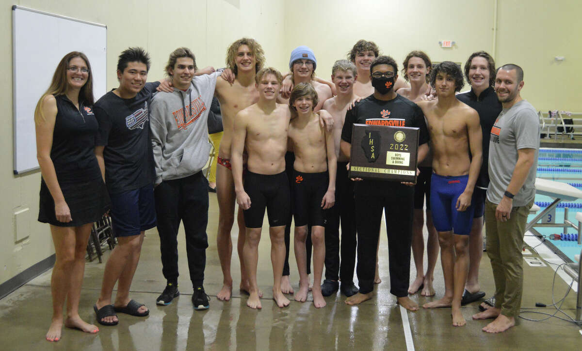 The EHS boys swim team with the sectional champions plaque.