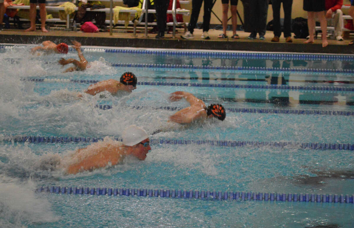 Cohen Osborn takes the lead in the 100-yard butterfly at sectionals on Saturday. His time of 51.78 made him the sectional champion and qualified him for state. 