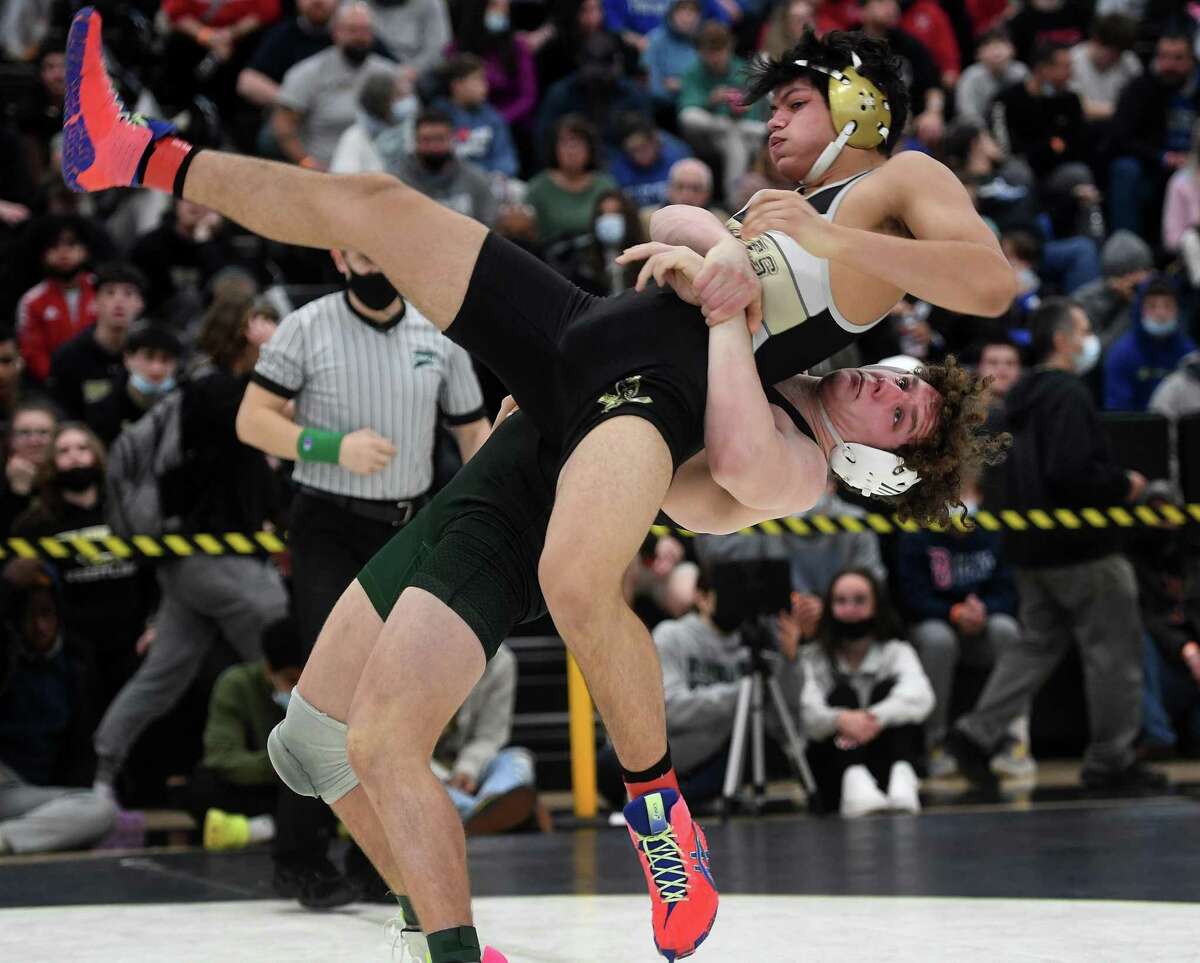 Norwalk’s Brendan Gilchrist takes down Trumbull’s Aethan Munden on his way to winning the 195-pound match final at the Class LL state championship Saturday.