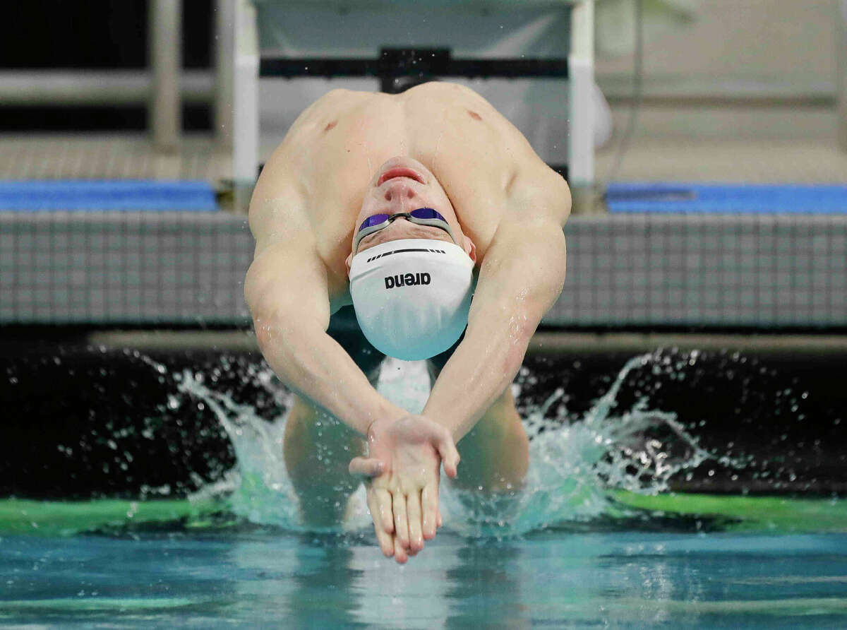 Garret Green of Kingwood competes in the Class 6A boys 100-yard backstroke during the UIL State Swimming and Diving Championships at Lee & Joe Jamail Texas Swimming Center, Saturday, Feb. 19, 2022, in Austin.