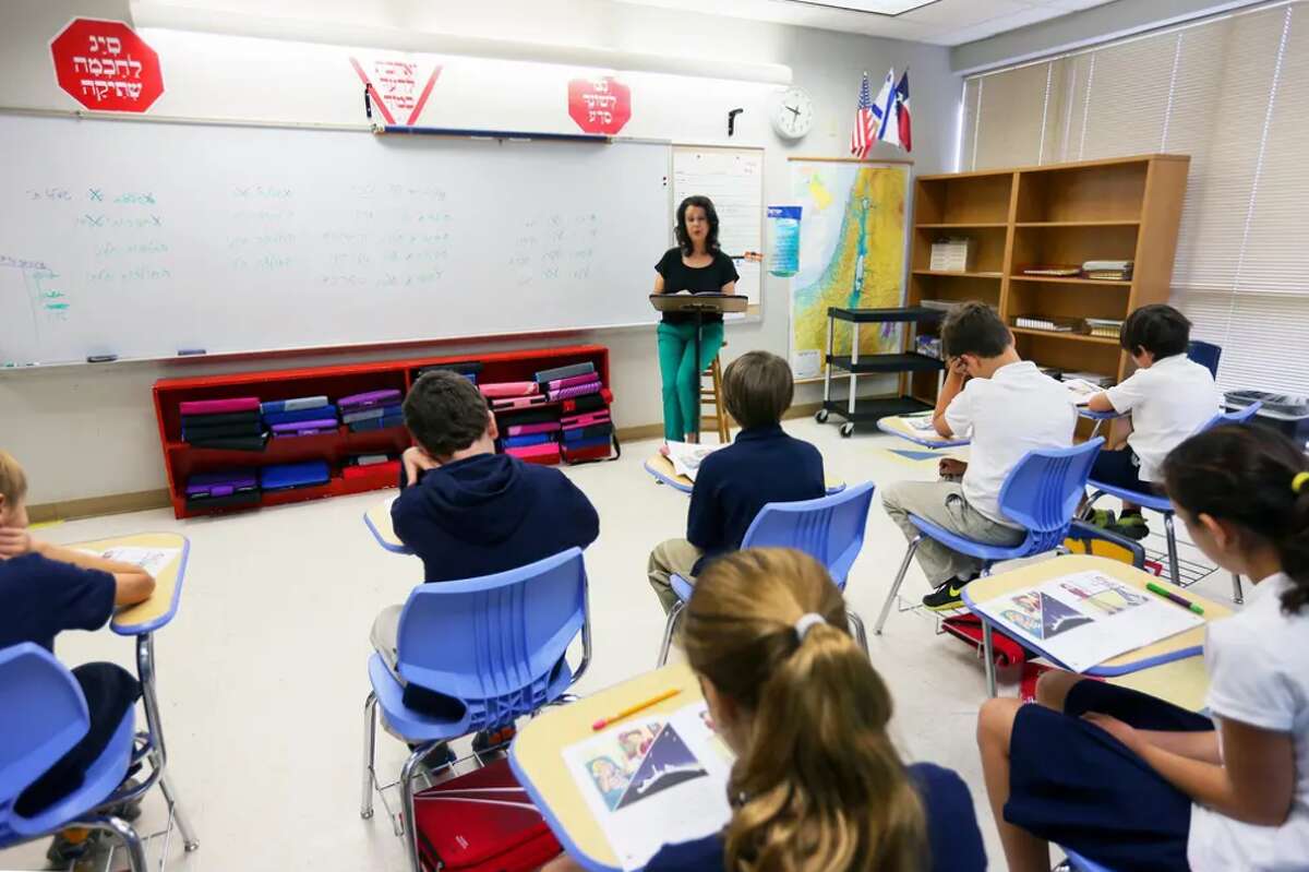 Fifth grade teacher Hagit Lifshitz leads a class in reading a book in Hebrew at Eleanor Kolitz Hebrew Language Academy, a public charter school in San Antonio, in 2013.