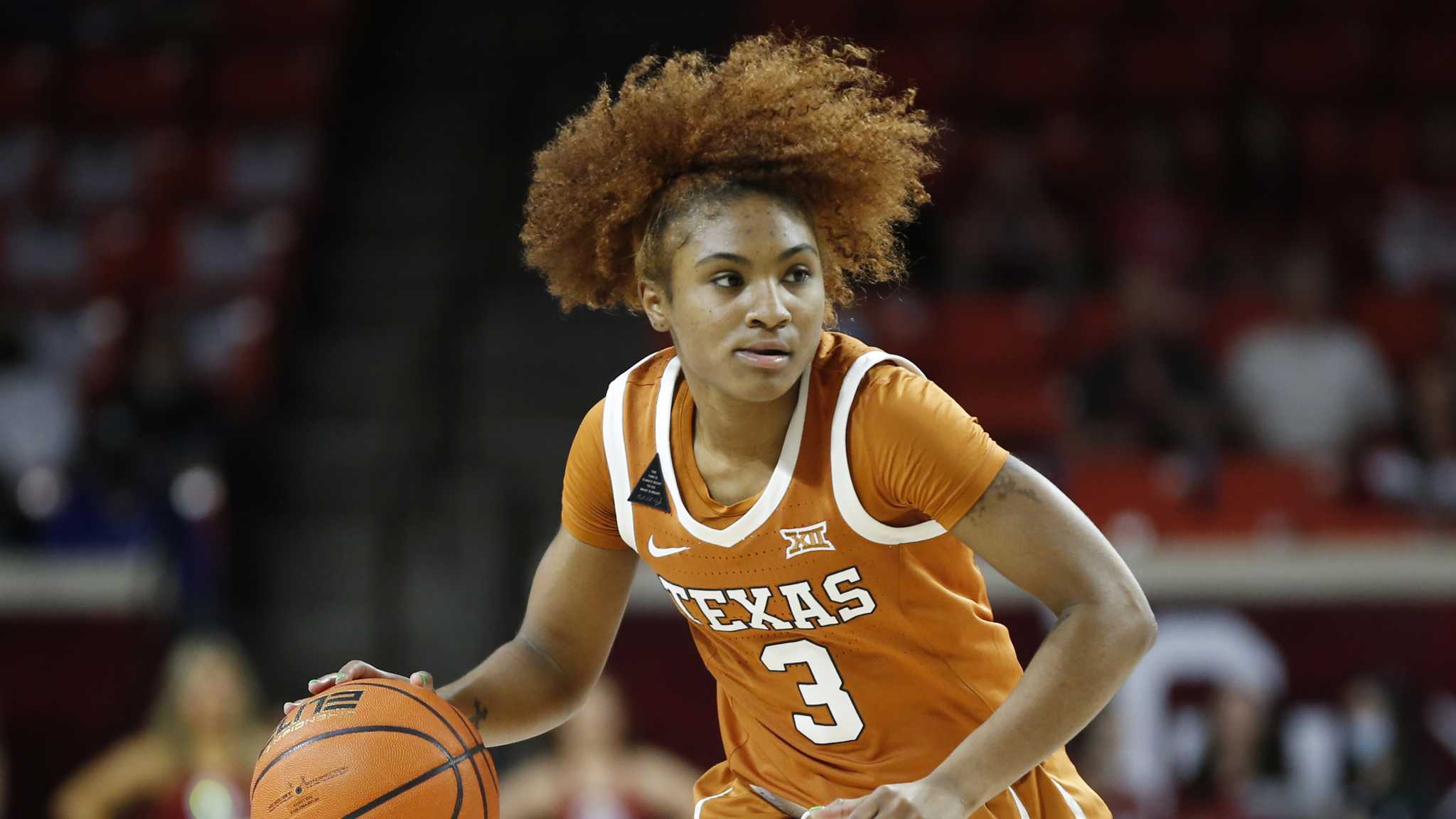 Rori Harmon leads No. 14 Texas women past West Virginia