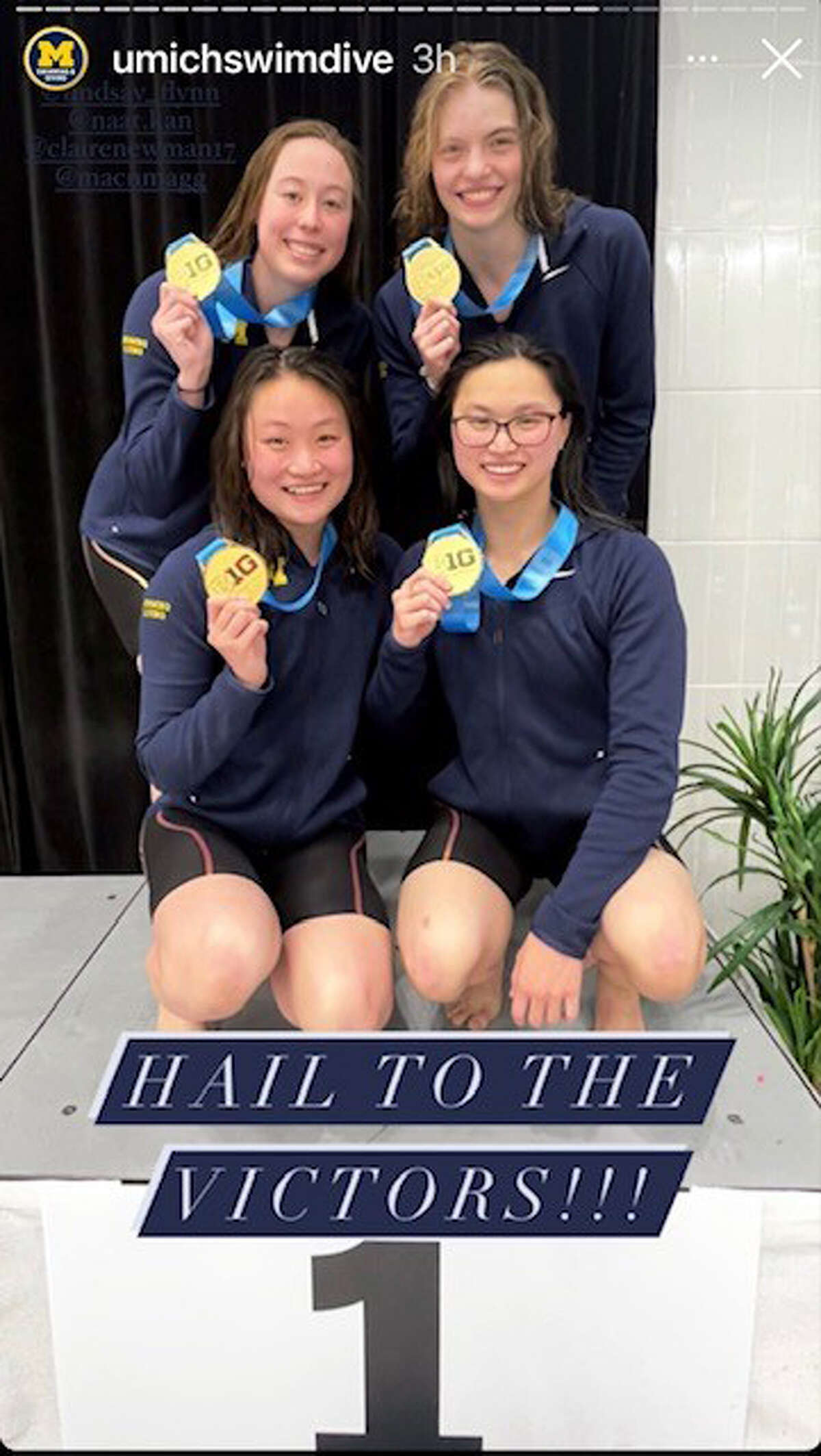 Michigan's Claire Newman (back right) poses with teammates Maggie MacNeil, Cheuk Kan, and Lindsay Flynn after setting a meet record and school record in the 200 freestyle relay at the Big Ten Championship held in Madison, Wis., Feb. 16-19, 2022.
