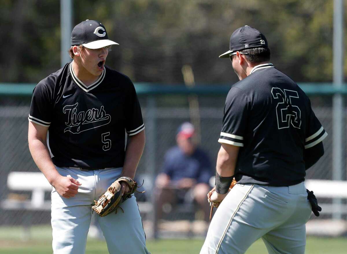 Conroe starting pitcher Andrew Berg (5) reacts toward first baseman Ricky Saldana (25) after getting Alex Diaz #8 of College Park to fly out to end the sixth inning of a District 13-6A high school baseball game at College Park High School, Friday, March 19, 2021, in The Woodlands.