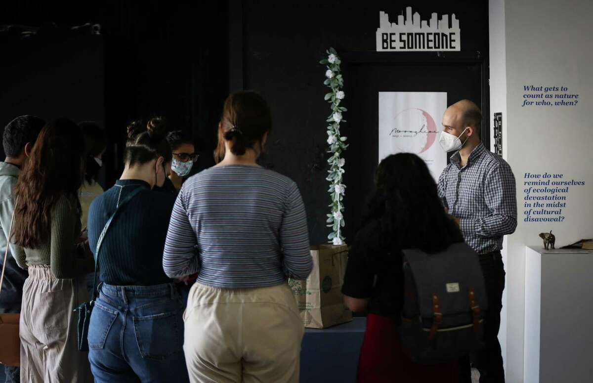 Aaron Ambroso, right, guides a discussion with a group of Rice University students Saturday, Feb. 19, 2022, at the Houston Climate Justice Museum and Cultural Center in Houston. Ambroso started the museum with Tiffany Jin.