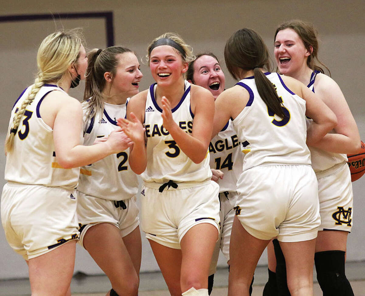 CM's (from left) Emily Williams, Avari Combes, Kelbie Zupan, Hannah Meiser, Maddie Brueckner and Olivia Durbin celebrate their team's overtime win over East St. Louis on Friday night in the title game of the CM Class 3A Regional in Bethalto.