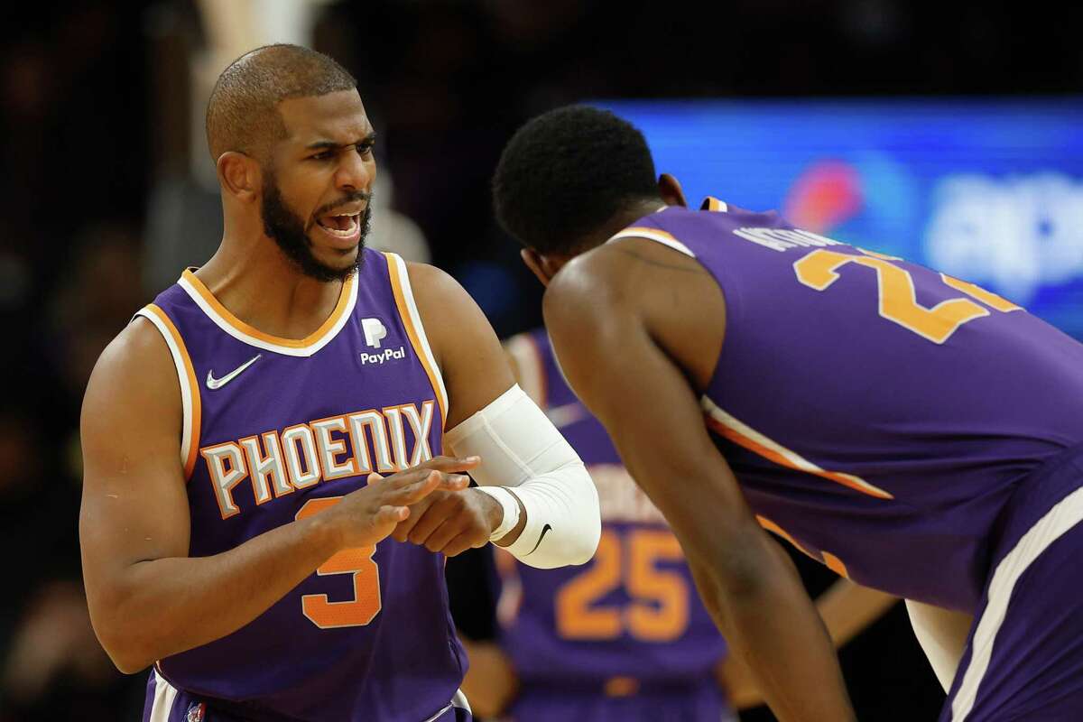 Chris Paul, grimacing after injuring his thumb against the Rockets, could miss most of the remaing games in the regular season for the Suns.
