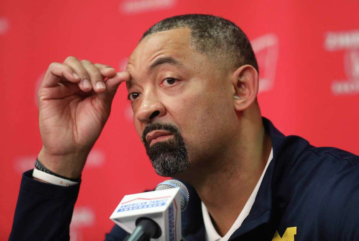 Michigan head coach Juwan Howard speaks to the media regarding a fight that broke out on the court after an NCAA college basketball game against Wisconsin in Madison, Wis., Sunday, Feb. 20, 2022. (Amber Arnold/Wisconsin State Journal via AP)