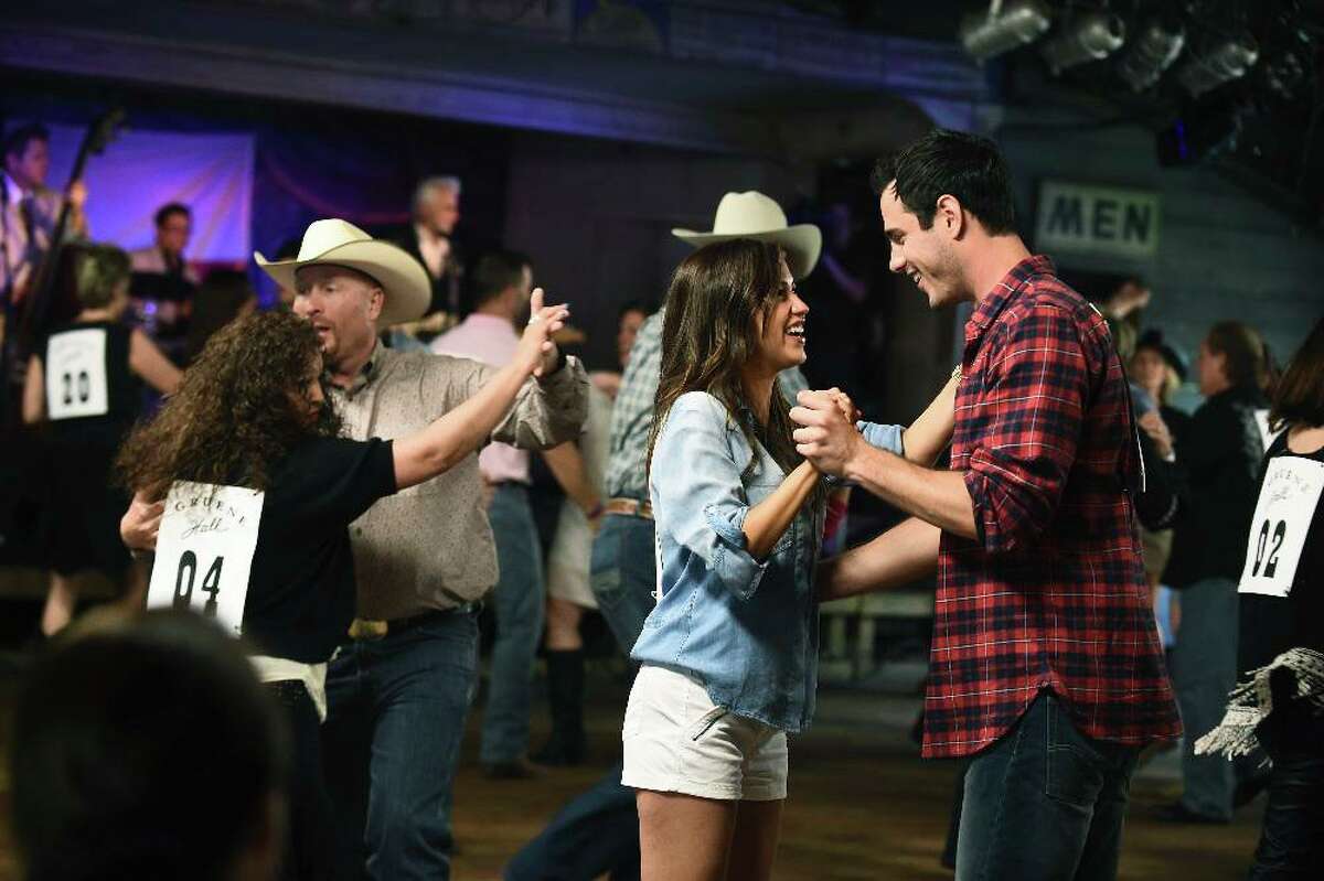 Kaitlyn Bristowe and bachelor Ben Higgins engage in fancy footwork during a Texas Two Step competition in Gruene Hall for a San Antonio episode of “The Bachelorette” on ABC in 2015.