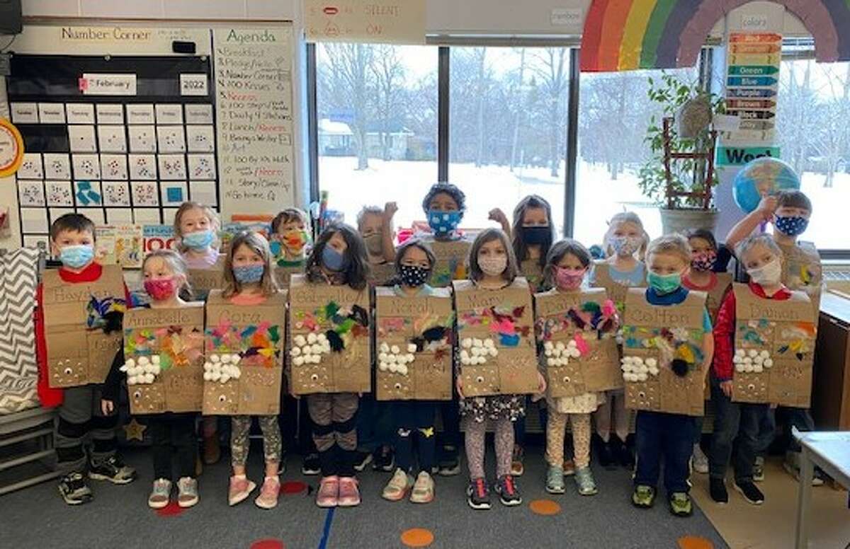 Cindy Lundberg's kindergarten class at Jefferson Elementary School poses for a photo in vests created as part of the school's celebration of the 100th day of the school year.