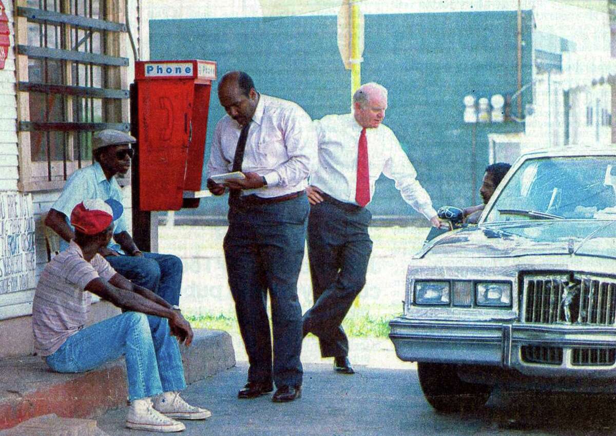 "Councilman David Moore, left, speaks with Irving Street-area residents Julius Brown and Alonzo Butler, while Mayor Maury Meyers talks to Lester Kirkmon Jr." Enterprise file photo July 1988