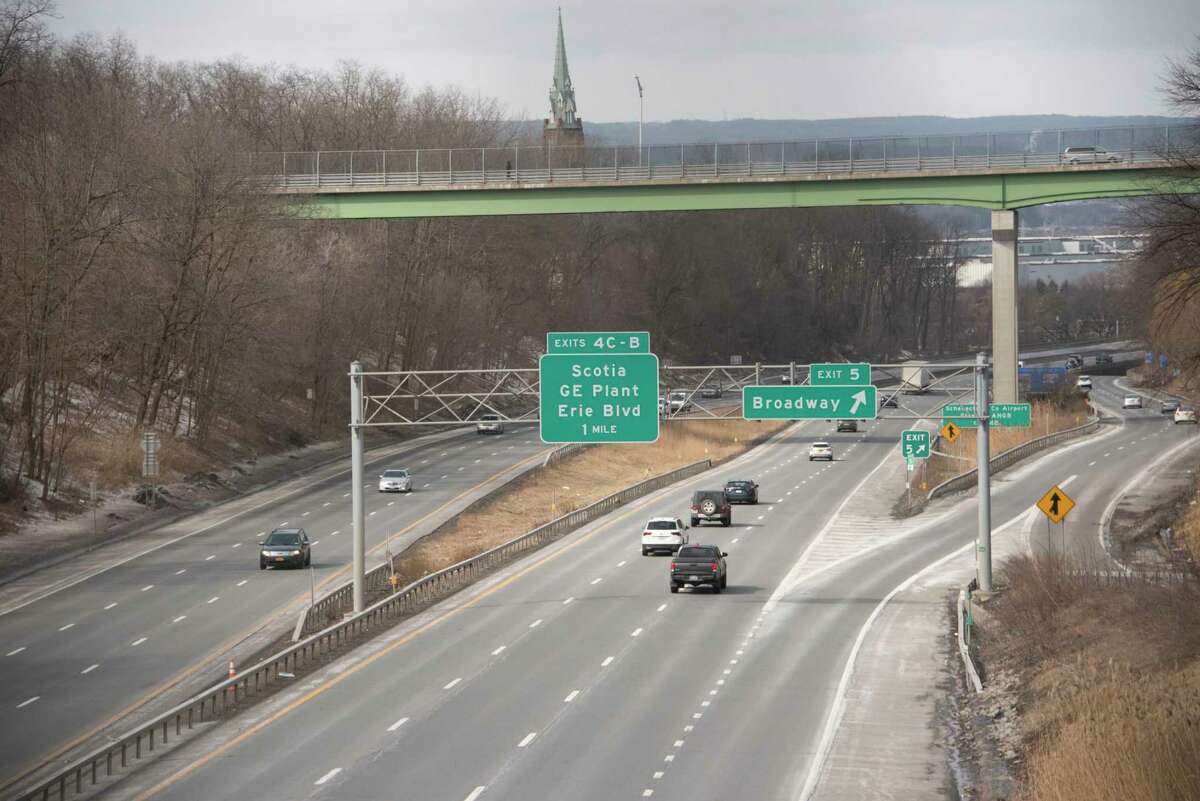 A pedestrian is seen crossing Cotton Factory Hollow Bridge which brings Francis Avenue over I-890 on Tuesday, Feb. 22, 2022 in Schenectady, N.Y. The bridge will be temporarily closed starting March 14 for about six months.