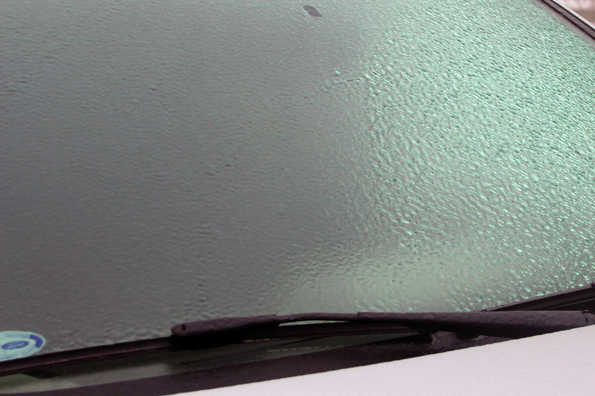A thin coating of ice covers the front winshield of a car in Manistee. The ice storm warning issued by the National Weather Service said there could be accumulations of ice of up to a quarter of an inch. The ice storm warning will be in effect until midnight Wednesday. 