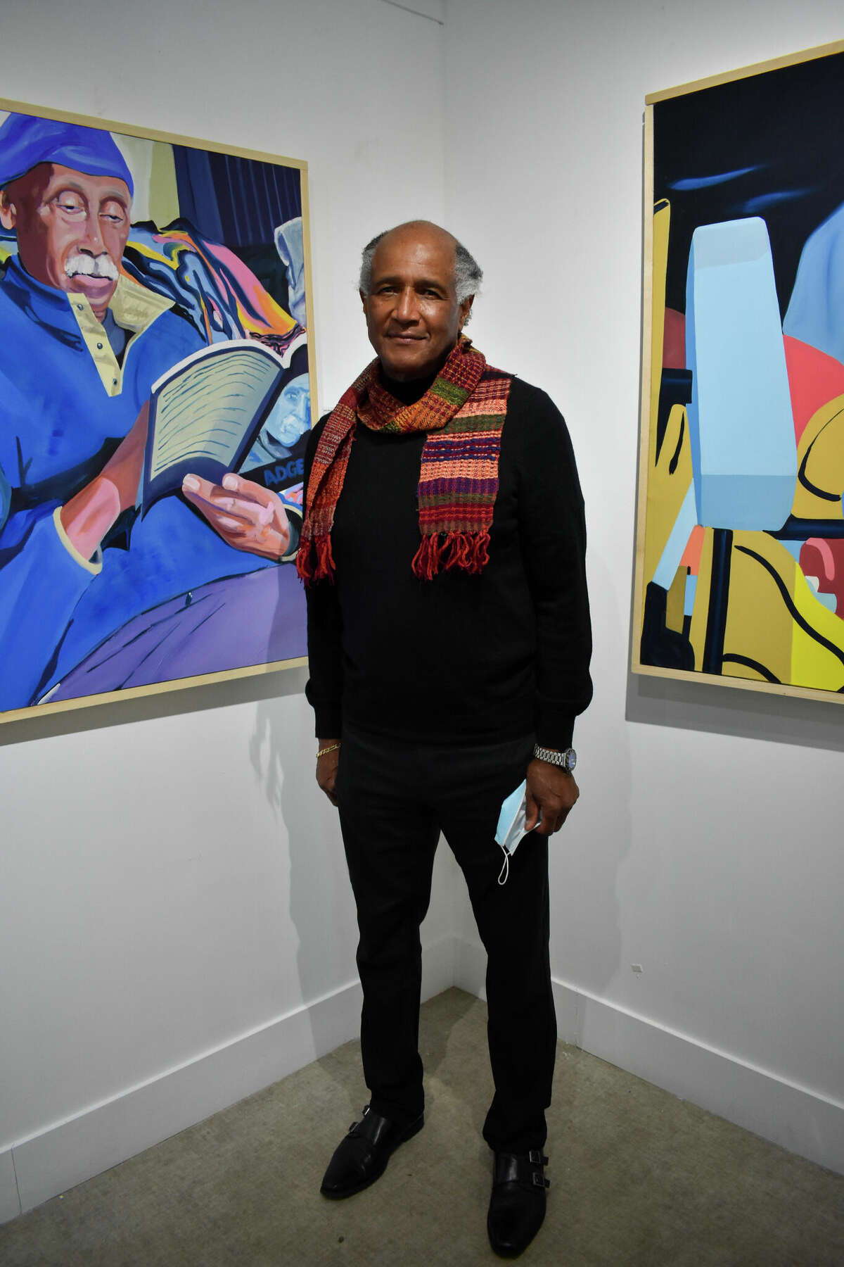 Larry Morse, curator of the exhibit "Absorption and Reflection" that showcased several of his paintings including his collection "Black Men Reading," on the artists' reception at City Lights Gallery on Feb. 20, 2022. 