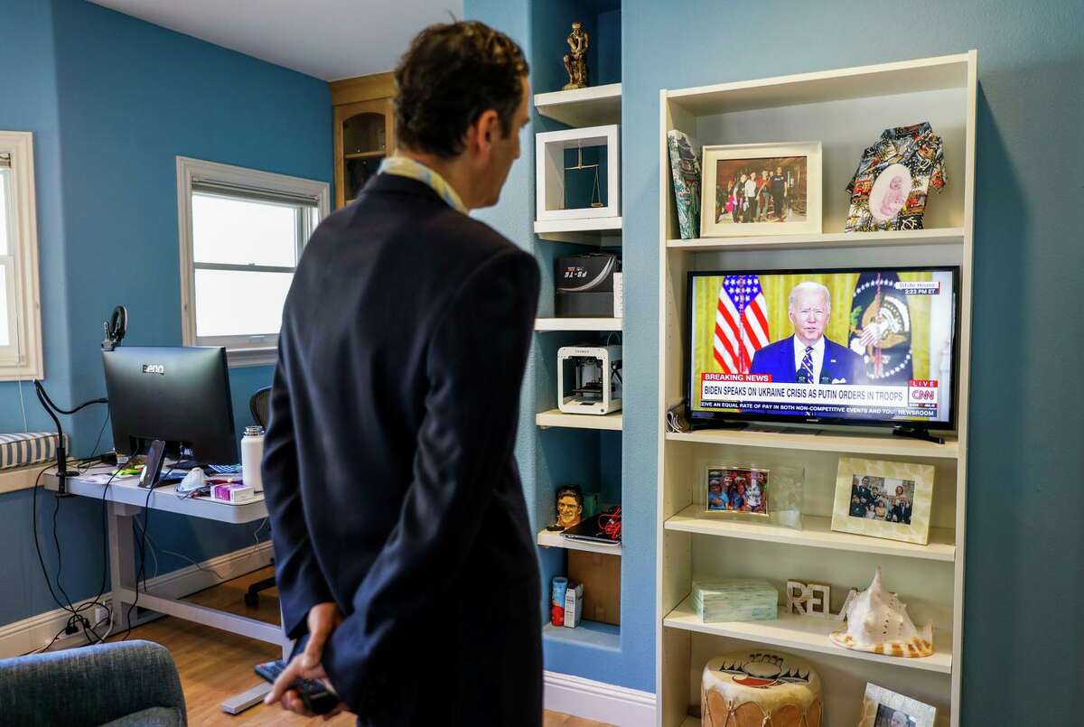 Andy Kurtzig, CEO of JustAnswer, who has about 270 employees based in Ukraine, watches President Biden give a briefing on the situation in Ukraine on Tuesday.