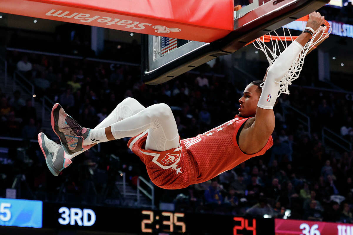 CLEVELAND, OHIO - FEBRUARY 20: Dejounte Murray #5 of Team Durant dunks against Team LeBron during the 2022 NBA All-Star Game at Rocket Mortgage Fieldhouse on February 20, 2022 in Cleveland, Ohio. 