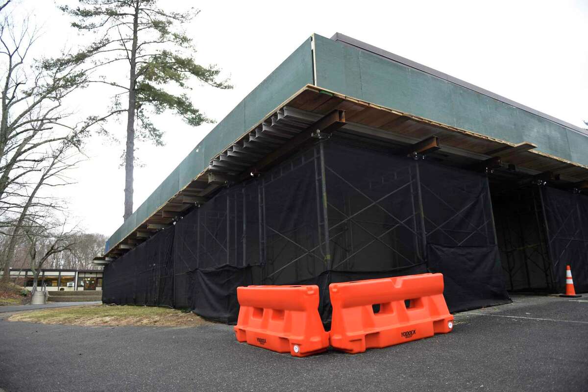 Scaffolding and netting is set up at Central Middle School in Greenwich, Conn. Tuesday, Feb. 22, 2022. Concerns about the building's structural integrity forced students to other schools earlier this month, but students are now back at Central Middle School.