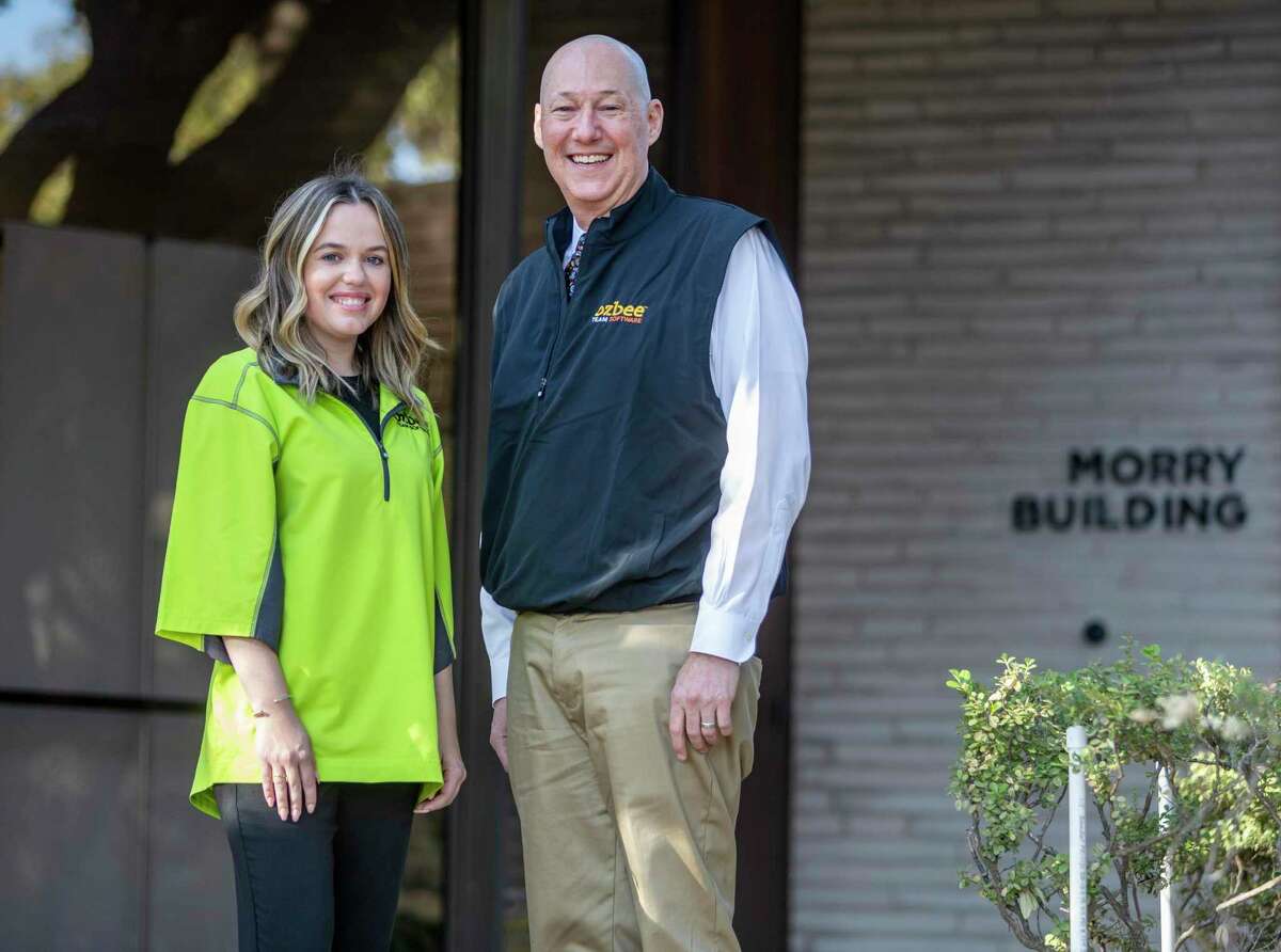 Jodi McCue and Brad Beldon pose Wednesday, Feb. 16, 2022 outside the Beldon corporate headquarters. The Beldon companies recently launched Ozbee Team Software, a construction software platform built on the Salesforce CRM services, with McCue as the Vice President of customer experience and Beldon as the CEO.