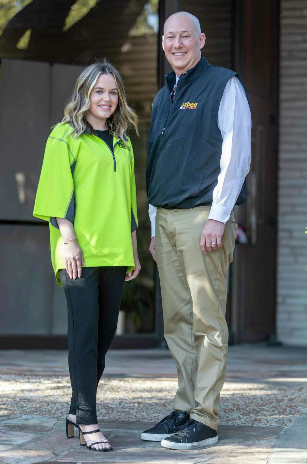 Jodi McCue and Brad Beldon pose Wednesday, Feb. 16, 2022 outside the Beldon corporate headquarters. The Beldon companies recently launched Ozbee Team Software, a construction software platform built on the Salesforce CRM services, with McCue as the Vice President of customer experience and Beldon as the CEO.