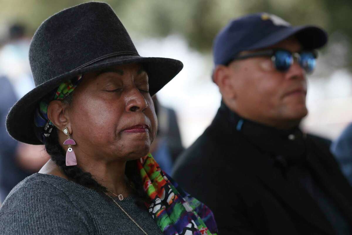 Angela Holder reacts during a ceremony Tuesday at Fort Sam Houston National Cemetery unveiling a marker for African American soldiers hanged after a deadly riot in Houston in 1917. Holder is a descendant of Cpl. Jesse Moore, among the first to be executed. The sloppiness of the trials that resulted in their convictions is now the focus of a clemency petition.