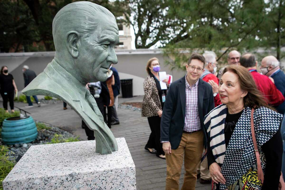 Ari Rosen, left, and Suzanne Jacobson pause to take a look at a new bust of President Lyndon Baines Johnson unveiled during a ceremony at Holocaust Museum Houston Monday, Feb. 21, 2022 in Houston. The museum observed Presidents’ Day unveiling a new bust of President Johnson in the Eric Alexander Garden of Hope. The sculpture by artist Chas Fagan was donated to Holocaust Museum Houston by the Warren Family in celebration of the life of Holocaust Survivor Naomi Warren.