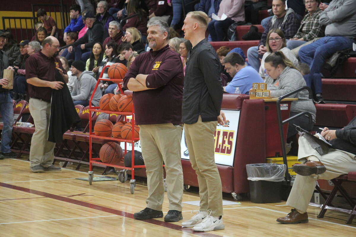 Deckerville coach Dale Stolicker and Ubly coach Branden Sorenson chat before the game.