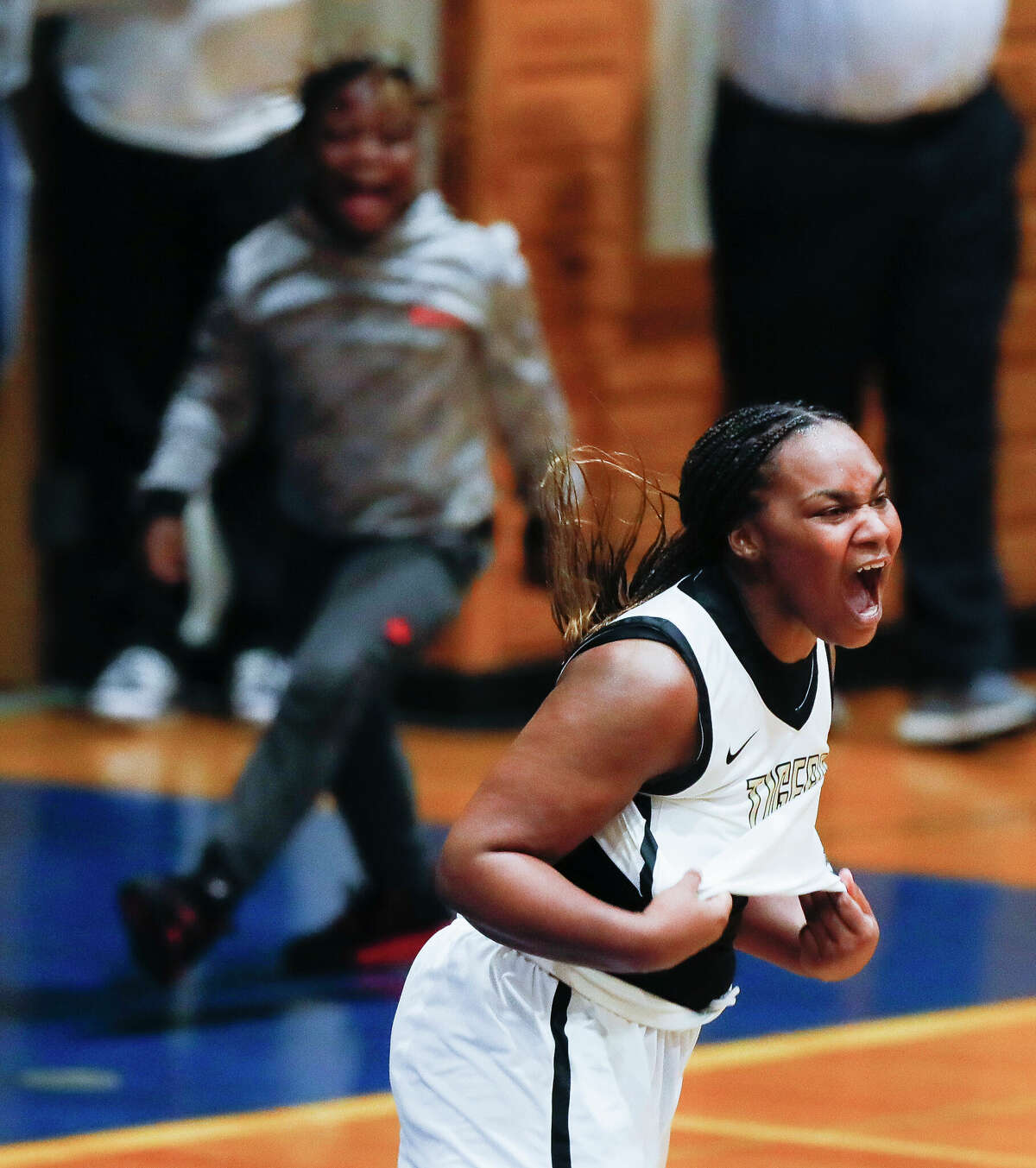 Conroe's Ra'Niyah Lewis (24) reacts after making a game-winning three-pointer to give the Lady Tigers a 40-38 win over Klein Collins during a Region II-6A quarterfinal high school basketball playoff game at Dekaney High School, Tuesday, Feb. 22, 2022, in Spring.