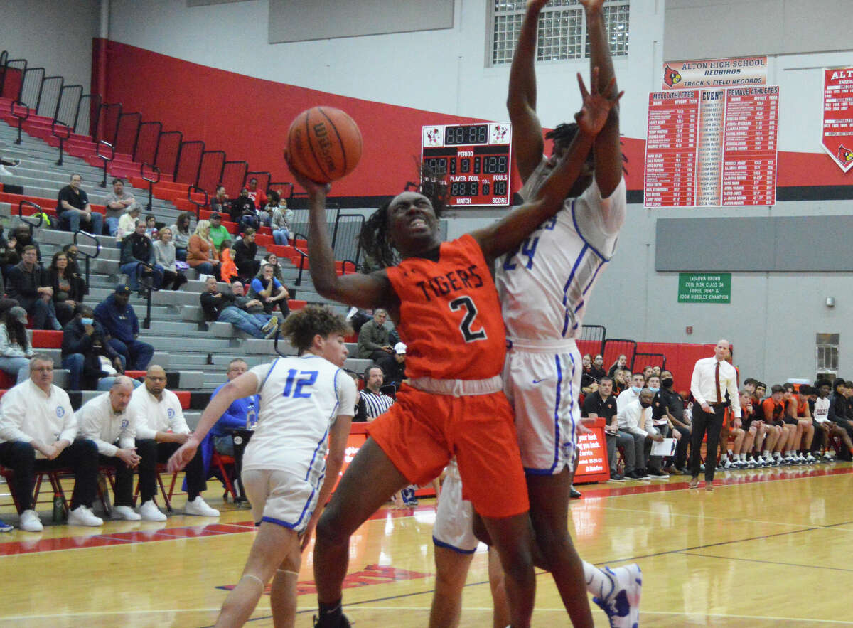 Edwardsville's Malik Allen goes up for a shot during Tuesday's game against Quincy in the first round of the Class 4A Alton Regional.