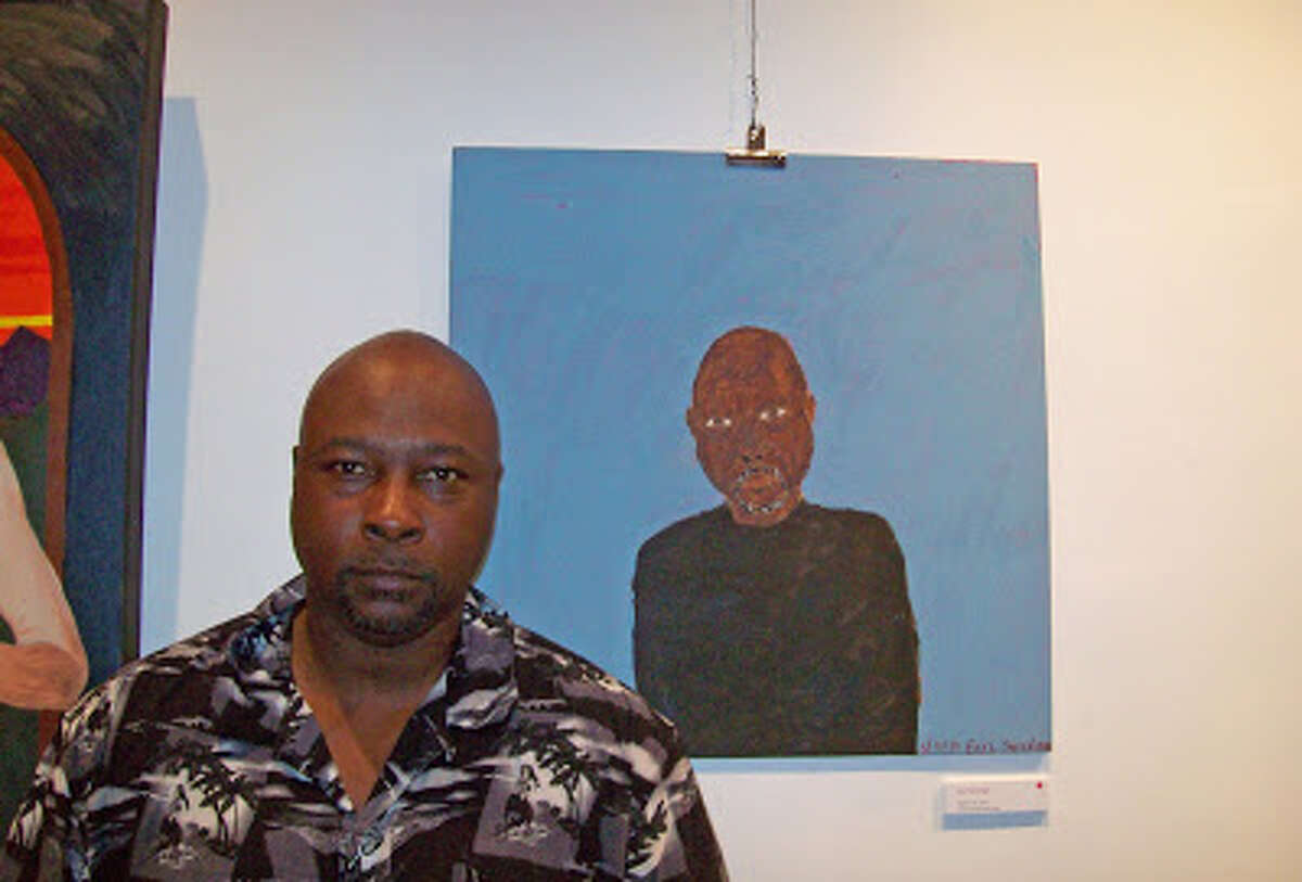 Hudson artist Earl Swanigan with a self portrait.