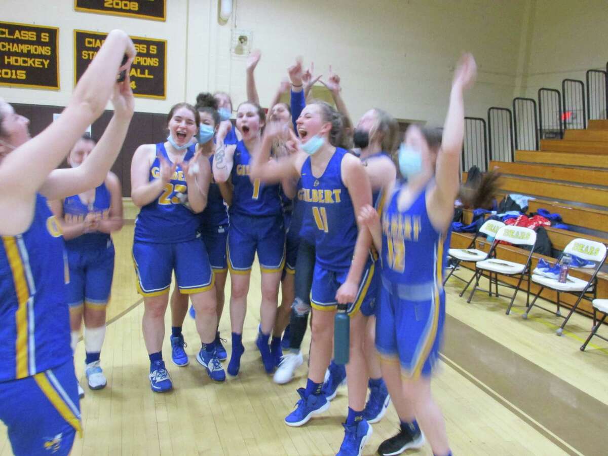 The Gilbert girls basketball team celebrates after knocking off No. 1 Thomaston Tuesday evening in the Berkshire League Girls Basketball Tournament semifinal round.