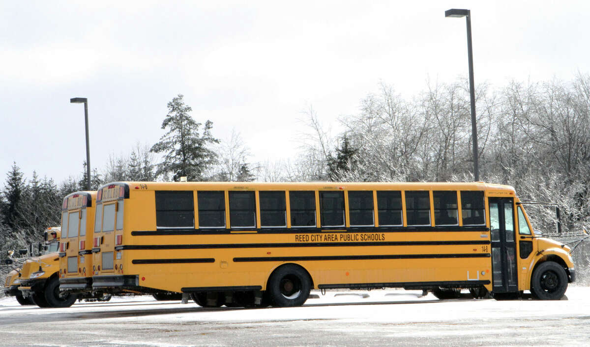 Reed City Area School Dsitrct buses remain parked at the garage, following another "ice day" on Tuesday.