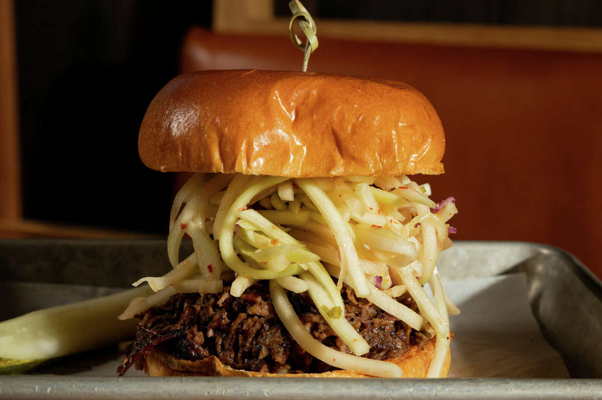 Loro Houston's brisket sandwich is oak-smoked and comes with a mountain of fries.