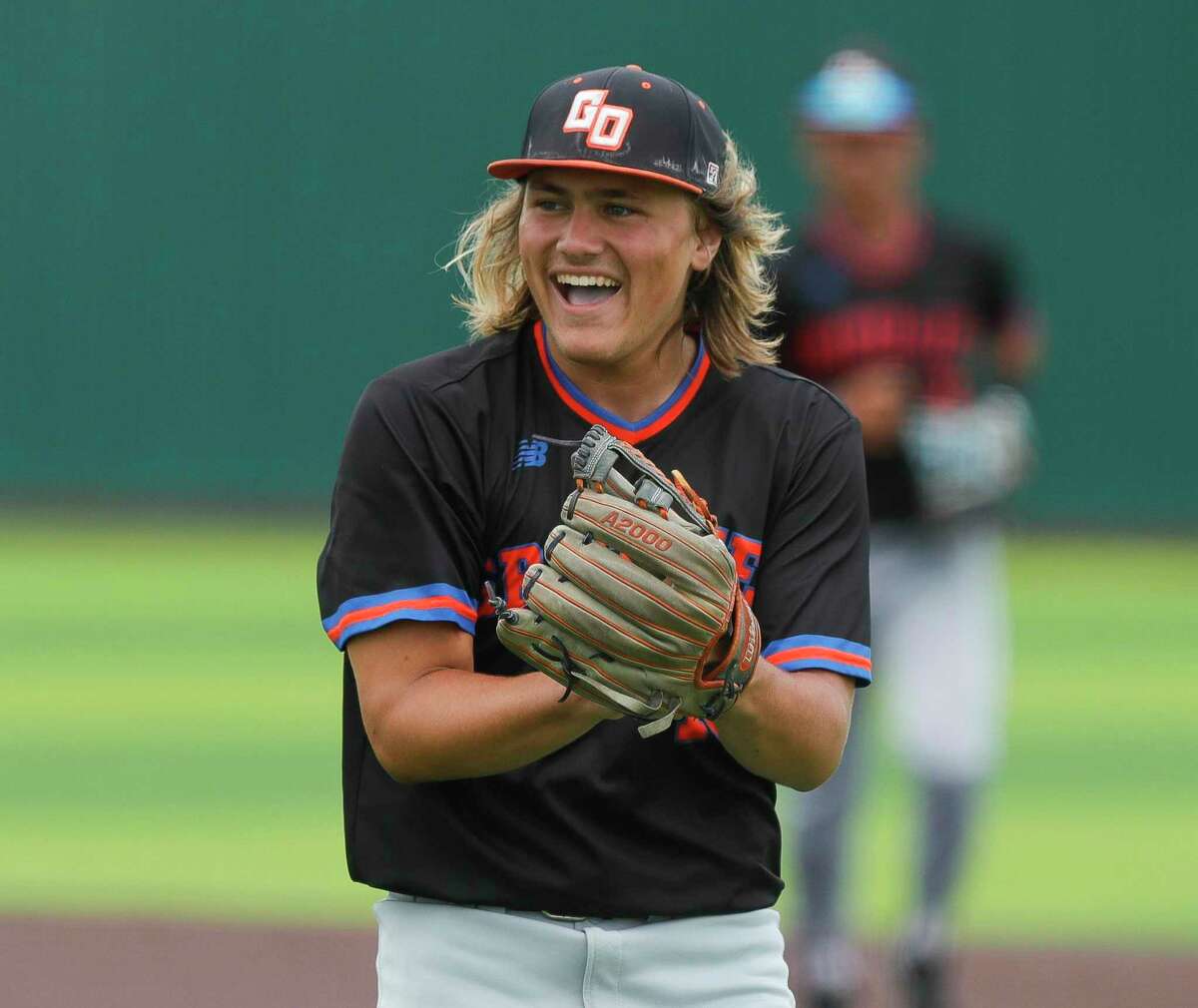 Grand Oaks starting pitcher Hudson Hamilton (19) reacts after a play by catcher Preston Havenor to end the fifth inning of a Region II-6A area high school playoff game at Tomball Memorial High School, Saturday, May 15, 2021, in Tomball.