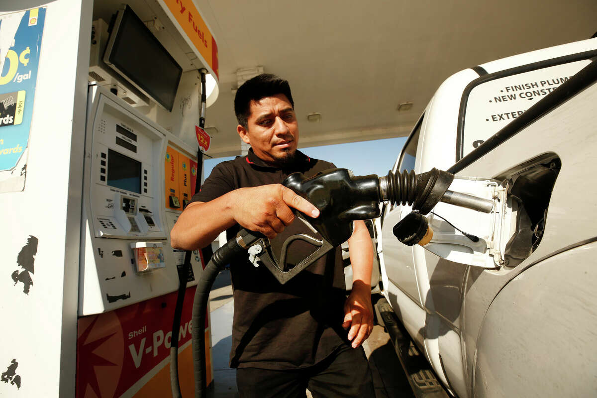 FILE PHOTO Alex Reyes, 28, began filling his work truck and stoped when he noticed the prices on the large marquee as drivers select from various fuels priced near of above over $6 dollars at a Shell gas station located at South Fairfax, West Olympic and San Vicente Blvd in Los Angeles as California gas prices hit an average price of $4.676 Sunday, setting the highest recorded average price for regular gasoline, according to AAA. Americas largest state by population has the highest gas prices in the country. The national average dropped slightly to $3.413 Sunday. Carthay Circle on Monday, Nov. 15, 2021 in Los Angeles, CA. (Al Seib / Los Angeles Times via Getty Images).