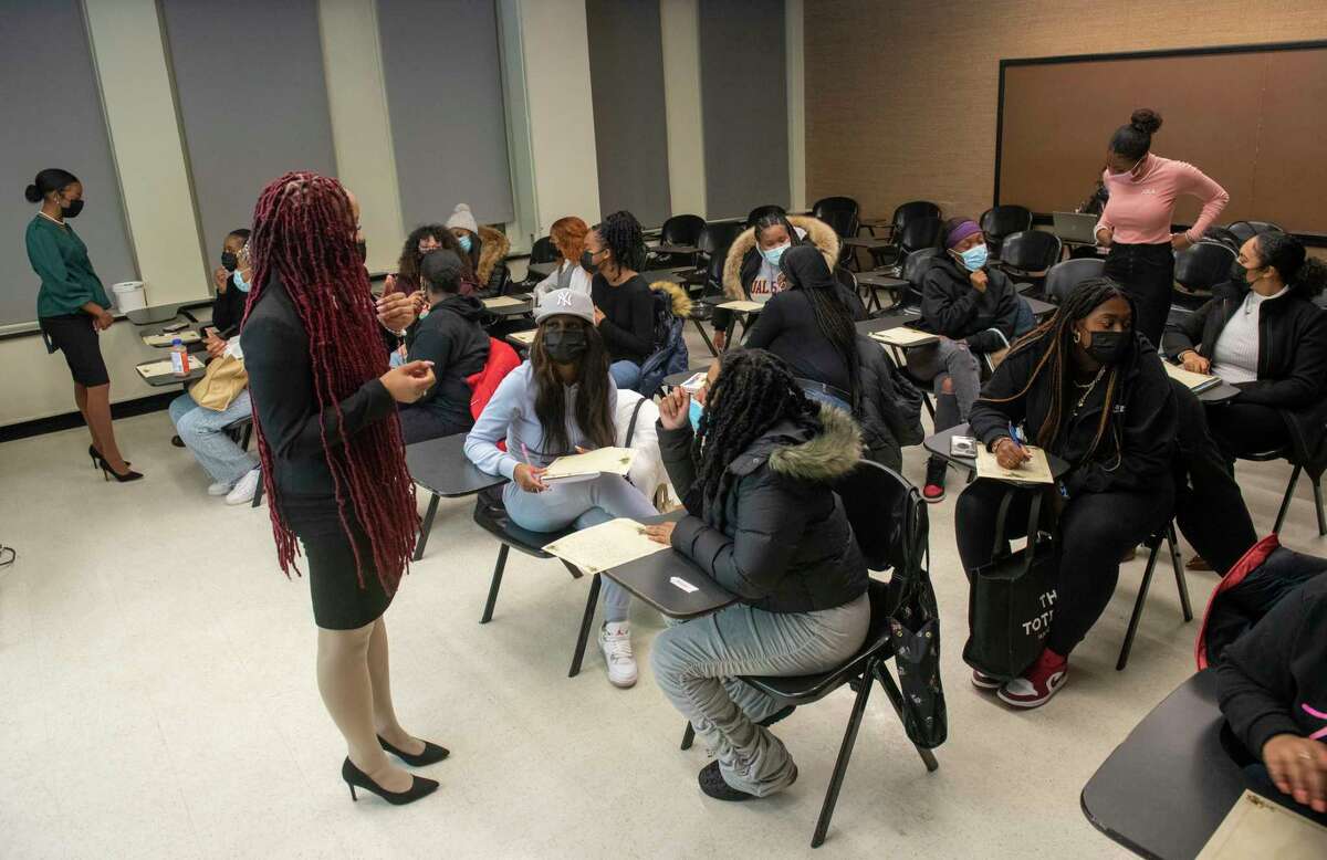 Alpha Kappa Alpha sisters, Johann Zephirin, left, Jada Ryder, center, and D’Shaya James engage with students during an “Enchanting Changes" event at University at Albany on Thursday, Feb. 10, 2022 in Albany, N.Y.