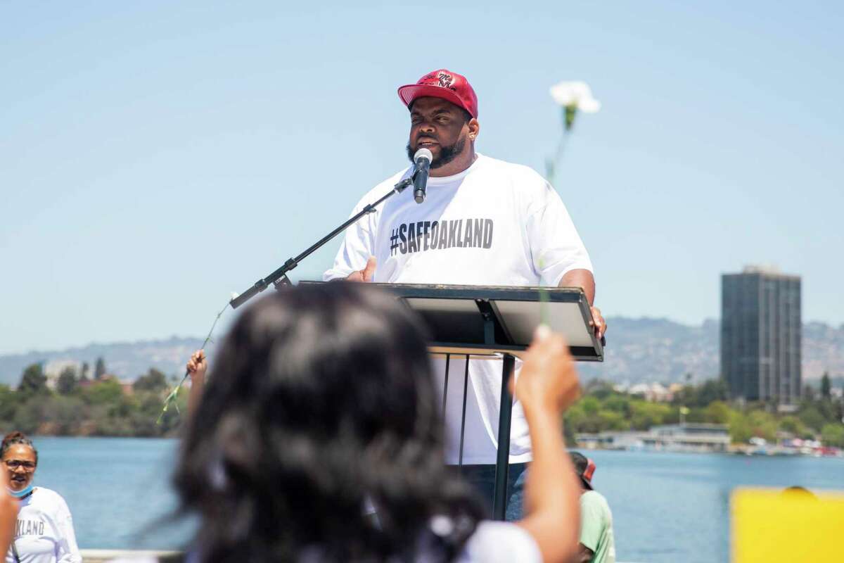 Antoine Towers, an Oakland Violence Interrupter, speaks during a rally in Oakland in July 2021.