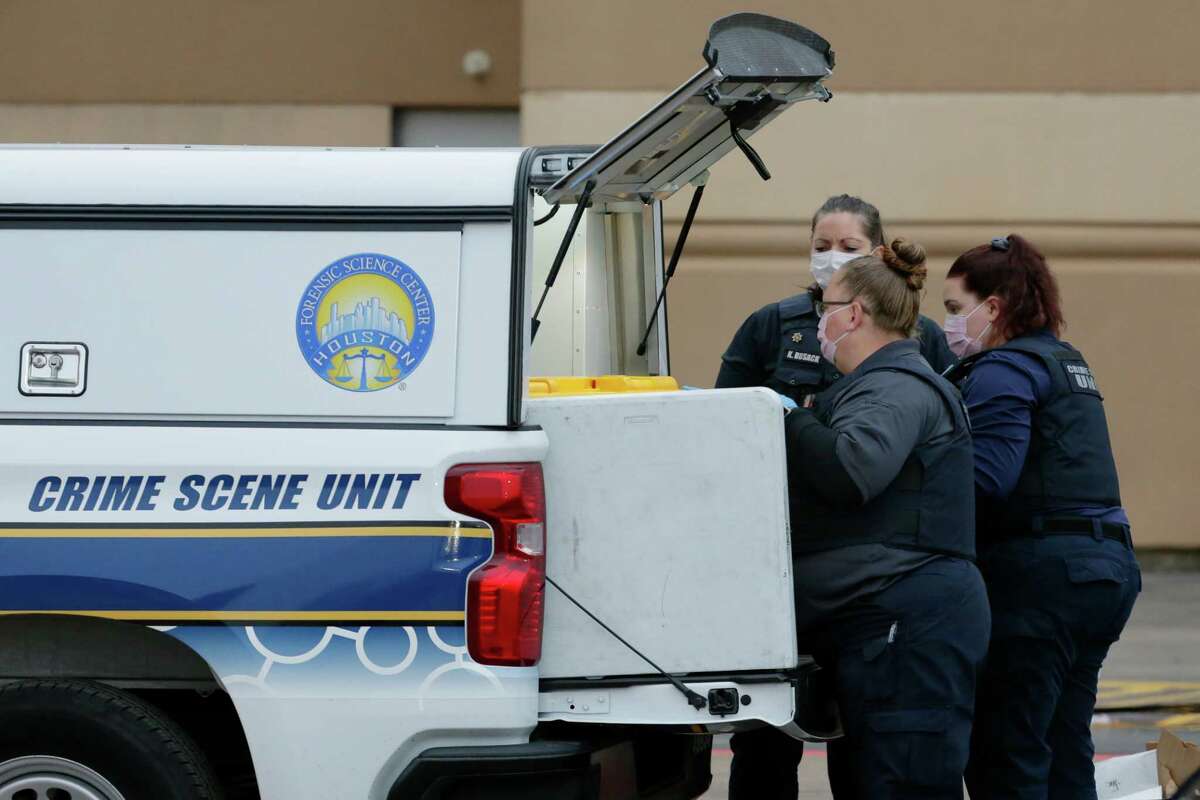 Investigators with the Houston Forensic Science Center unload equipment before entering the main north entrance of PlazAmericas Mall, located at 7500 Bellaire Blvd., after an officer involved shooting Wednesday, Feb. 23, 2022 in Houston, TX.