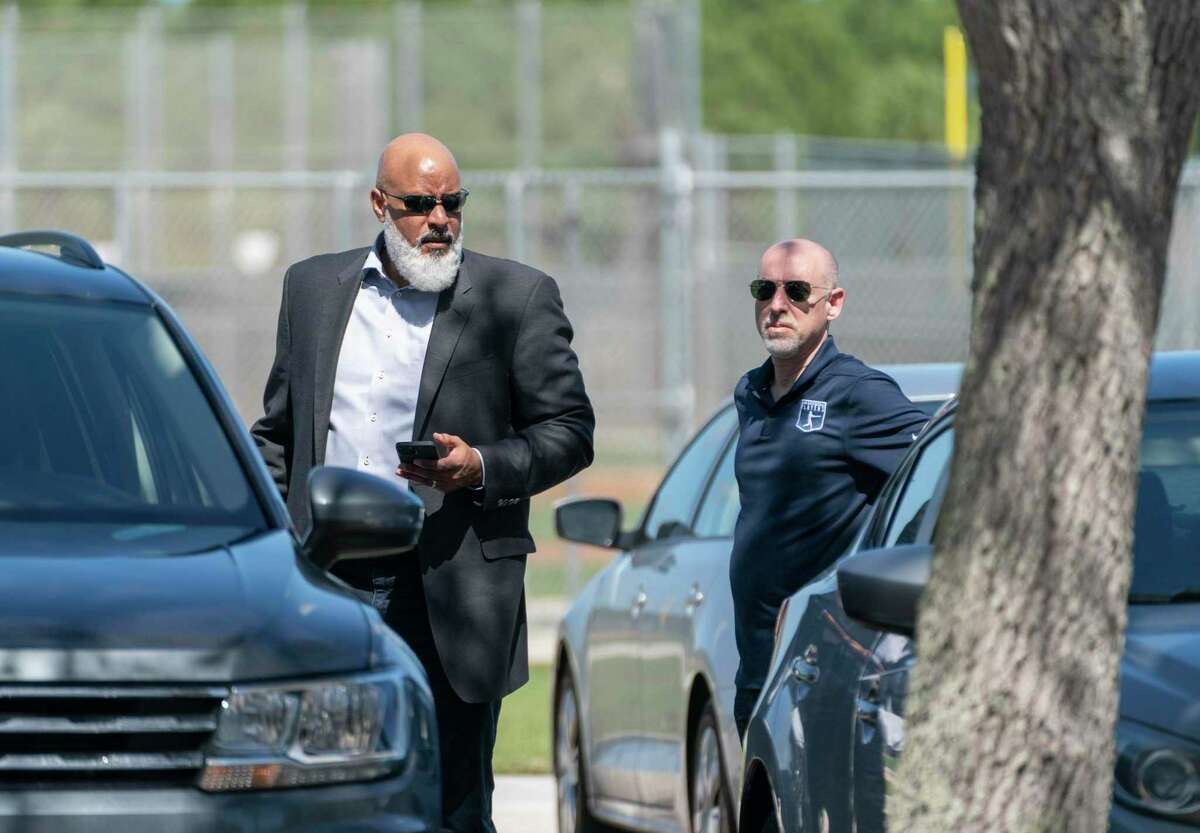 Major League Baseball Players Association executive director Tony Clark, left, and chief negotiator Bruce Meyer arrive for contract negotiations at Roger Dean Stadium in Jupiter, Fla., Wednesday, Feb. 23, 2022. (Greg Lovett/The Palm Beach Post via AP)