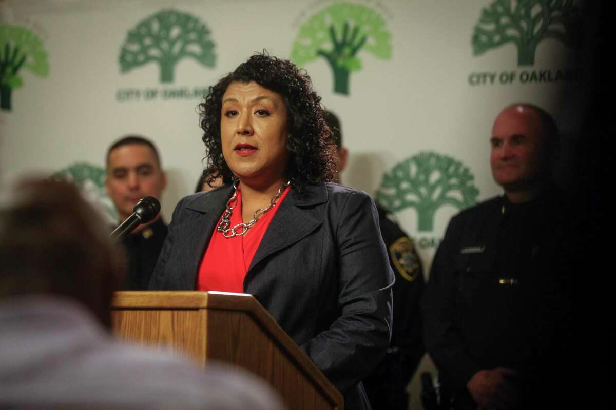 Deanna Santana speaks at an Oakland City Hall press conference to announce the stepping-down of Interim Police Chief Anthony Toribio in 2013.