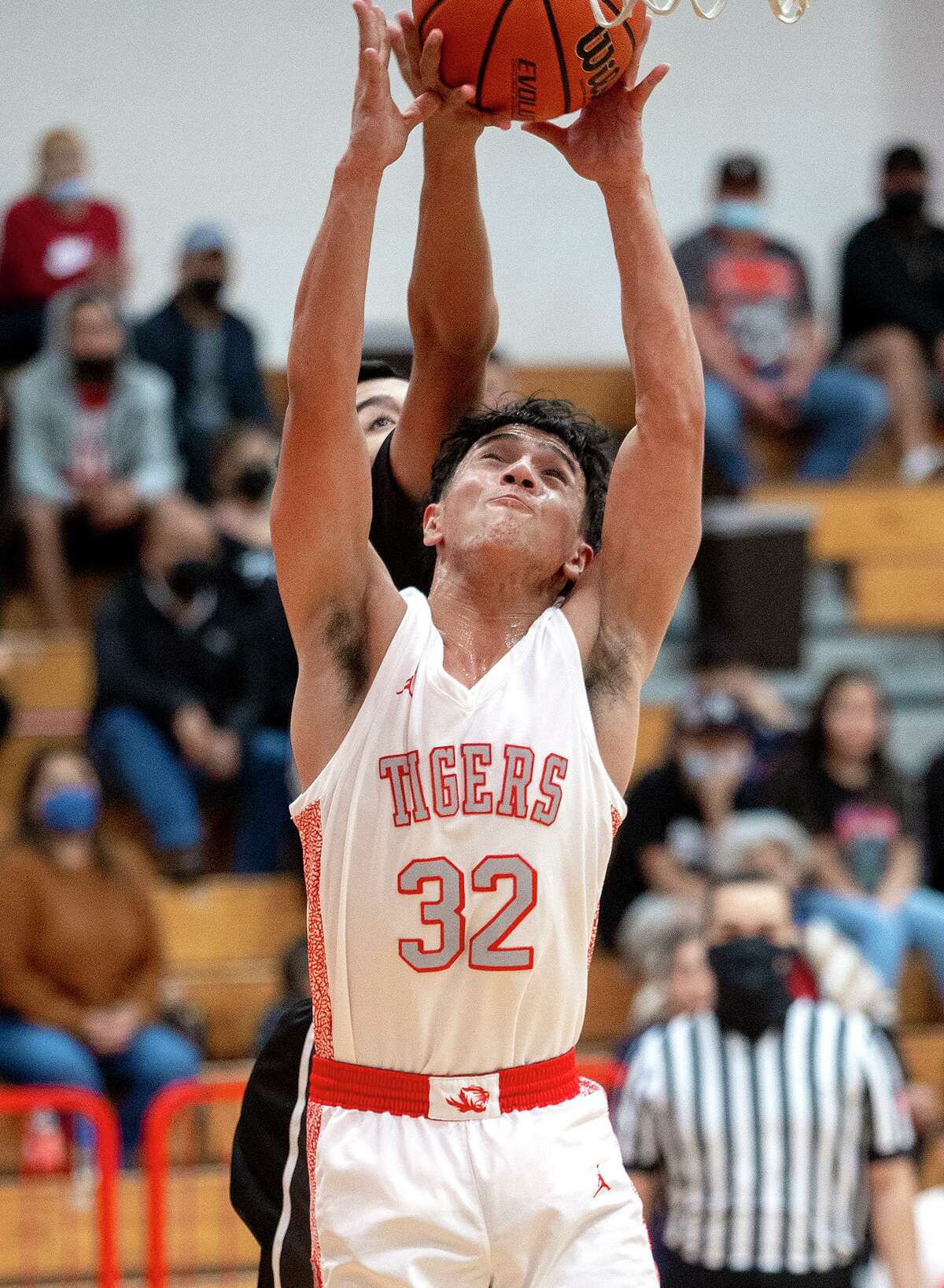 Martin High School’s Brandon Villarreal fights for a rebound during a game against United South High School Tuesday, Jan. 4, 2022 at Martin High School.