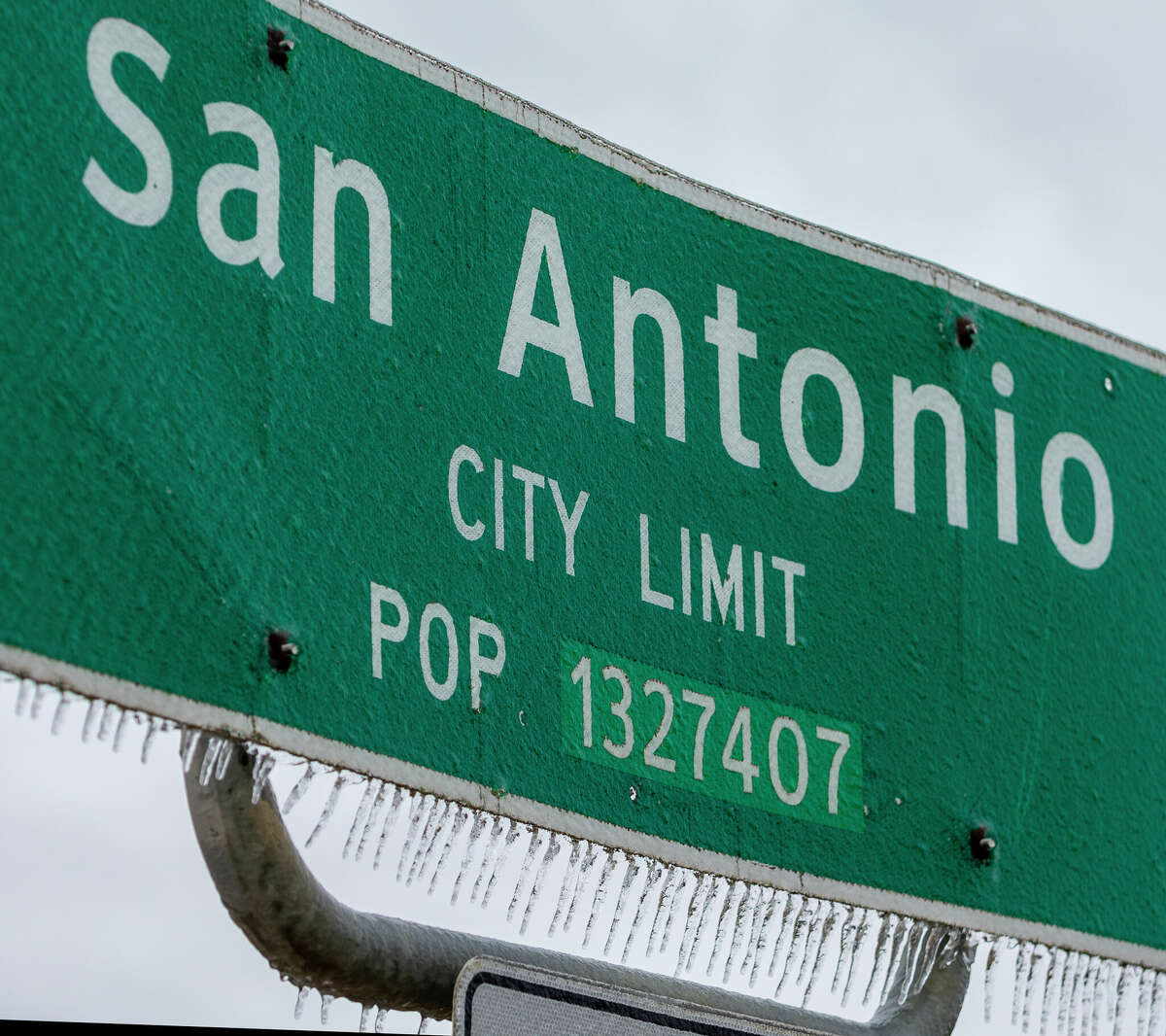 Icicles hang Thursday morning, Feb. 3, 2022 off a San Antonio city limit sign on Blanco Road on the city's north side. 