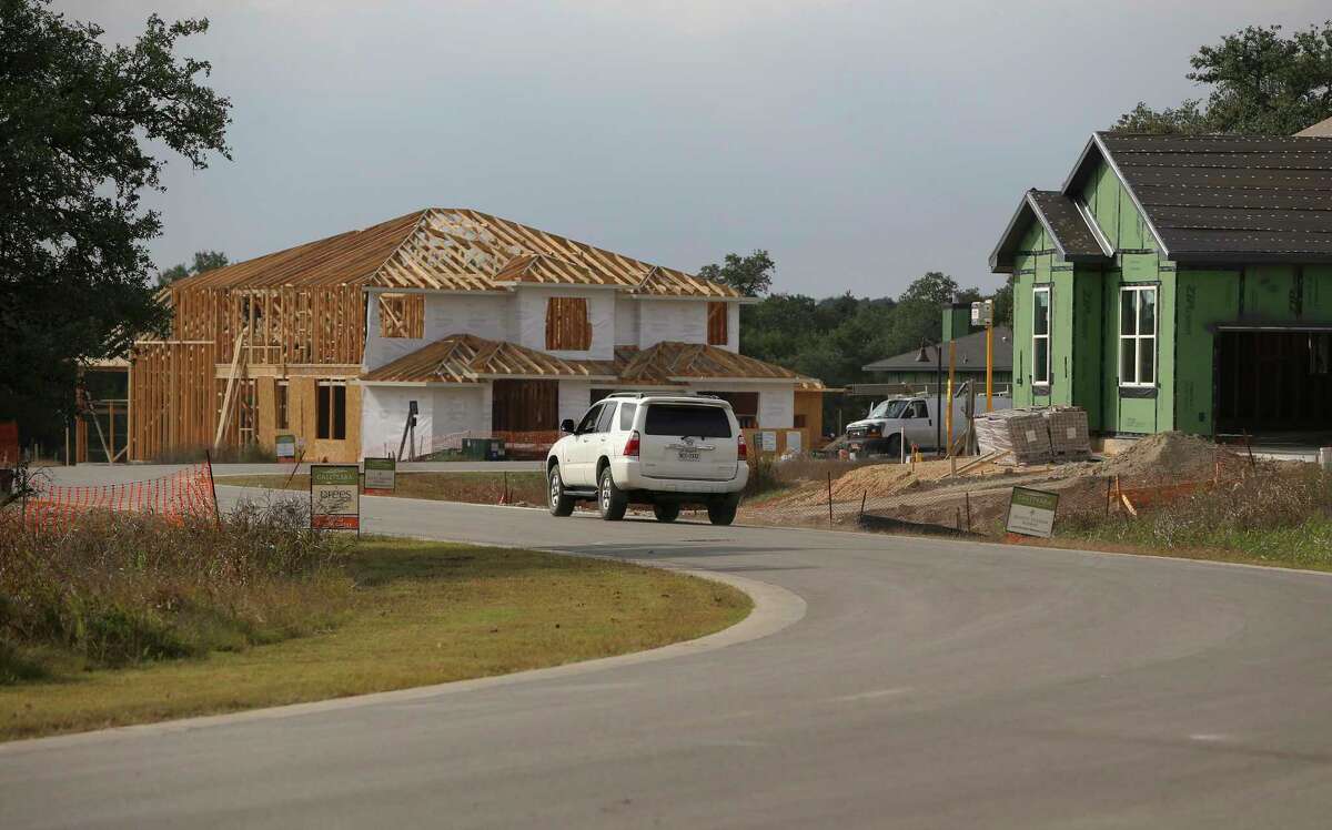Homes under construction in a subdivision near Dripping Springs are seen in December.