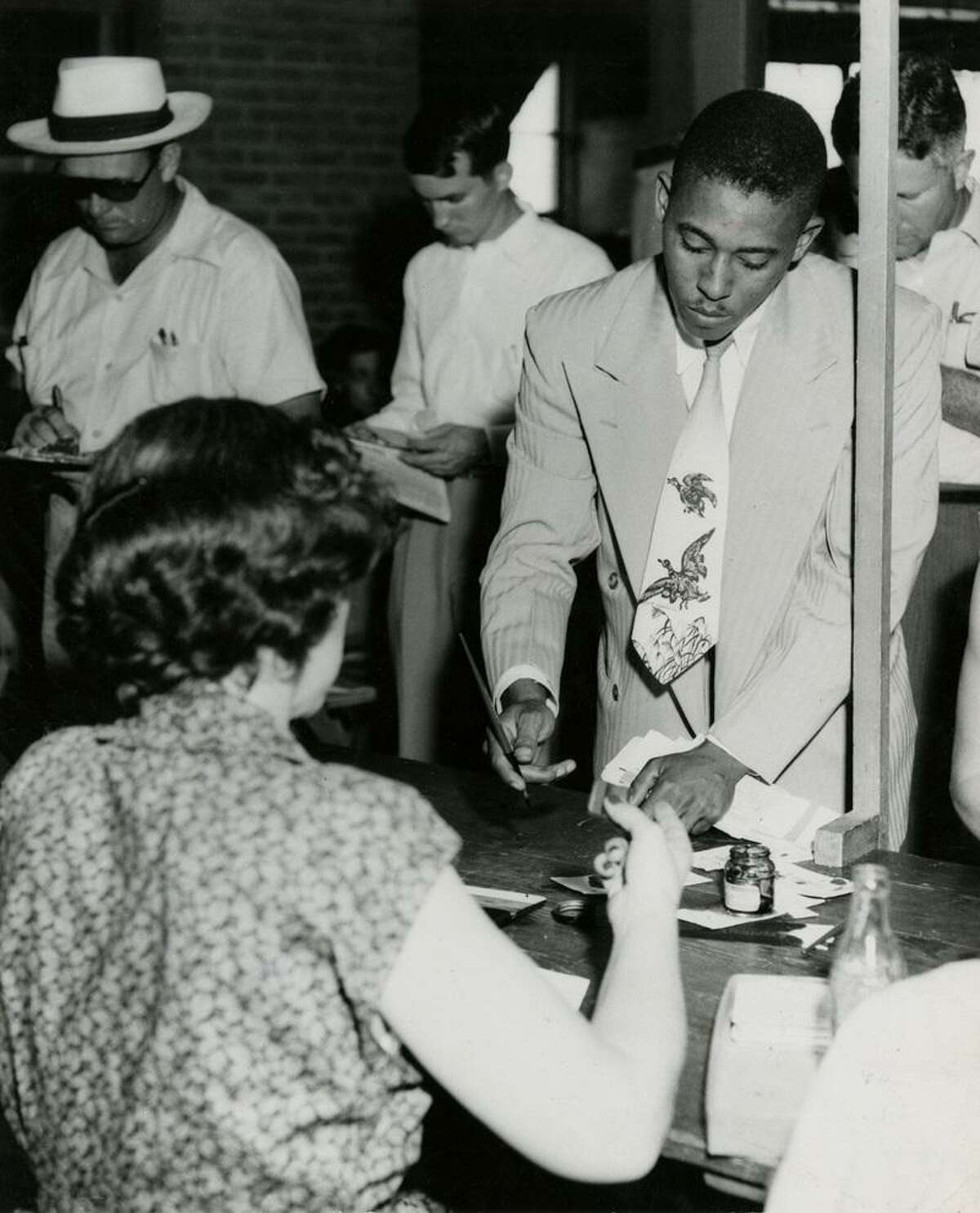 John S. Chase is shown enrolling at the University of Texas in 1950, just two days after the Sweatt v. Painter U.S. Supreme Court ruling opened white schools to Black students.