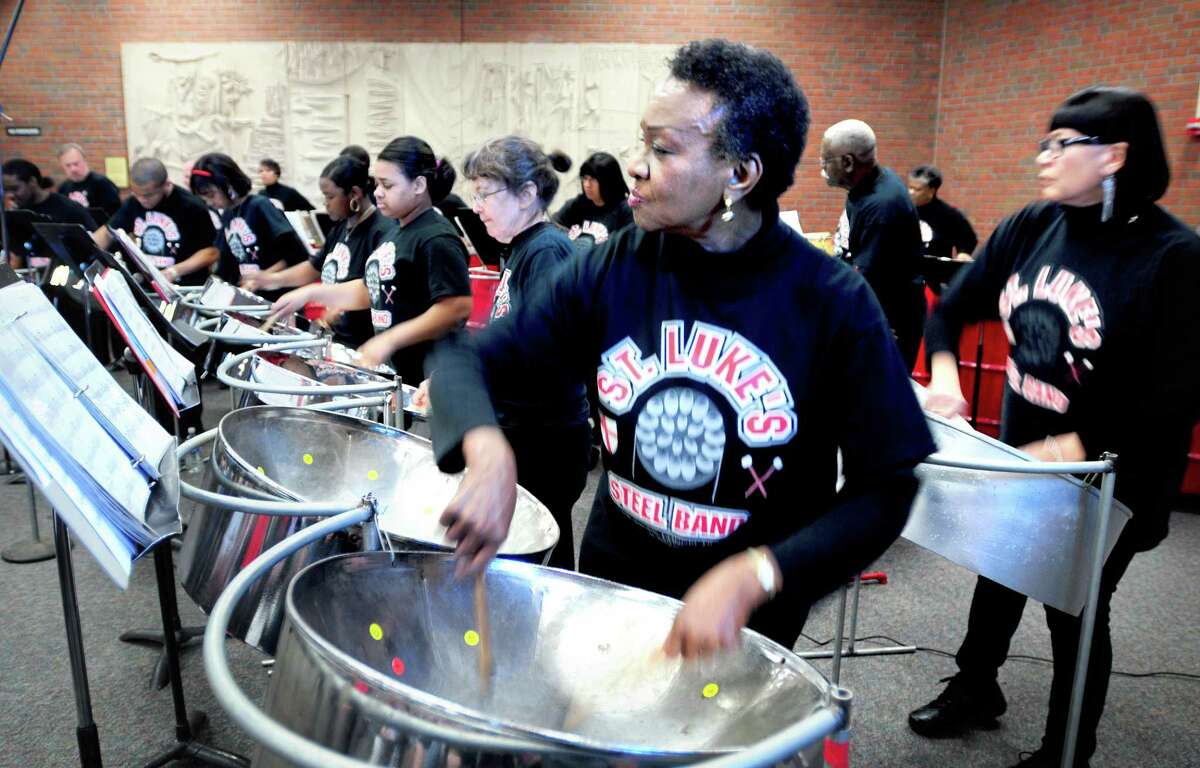 Joy Scott, center, of New Haven performs with the St. Luke’s Steel Drum Band at a concert sponsored by the Hamden Arts Commission in 2012.